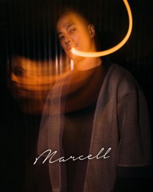 Marcell Siahaan Instagram - Acara ini berawal dari saya ‘menantang’ anak-anak @thehallwayspace_ @rillyrobbi untuk mereka menyelenggarakan sebuah konser intim di Hallway, sebuah tempat seru dan unik yang berada persis ditengah-tengah sebuah pasar basah tradisional jaman saya kecil bernama Pasar Kosambi, Bandung. 

Buat mereka yang minimal seangkatan dengan saya pasti tahu kalau disana adalah salah satu tempat terbaik membeli seragam sekolah dan juga seragam Pramuka beserta pernak-perniknya. Plus, Bandung Teater, sebuah bioskop yang sekarang berubah menjadi Hallway, yang didalamnya ada banyak sekali gerai ‘independen’ fashion, musik sampai kuliner. 

Menyenangkan sekali.

Sebuah portal pertemuan, melting pot, tempat bertemunya banyak kalangan. Teman-teman bermusik di masa lampau seperti @gebegdrum @papapyopie @luki_govinda hadir disana, semua masih dalam keadaan sehat dan terus produktif.

Hadir juga teman-teman dari kalangan disabilitas antara lain @guntur.abah dan teman-teman tuli yang khusus saya undang, dan tidak lupa meminta kepada penyelenggara menyediakan penerjemah bahasa isyarat demi kenyamanan mereka.

Terima kasih kepada keluargaku, my Avengers, adik-adik musisi kesayangan @rishanda @renitamartadinata @jeffwatti @matthewmanwell @cesar_alkautsar @ivanalidiyan @imotimot dan masku @eugen.bounty GILAAAA! Walaupun udara panas banget, rebutan oksigen, tapi selalu maksimal. ❤️

Adikku, anakku, @mraviandika untuk duet maut kita di ‘Firasat’, THANK YOU, Sir! ❤️

Tim produksi MARCELL yang fantastik @anggianggoro @rickysophian @harfiovan @reyhin1603 @boyblackcurrant @heruusiswanto dibawah komando @gafurdinno ✅

Dan tentunya Kasubdit Ketampanan @ronaldreborn dan Kasubdit Dokumentasi dan Sejarah @bengurion.works yang super, dan Staf Khusus @shandy_age dan Kepala Rumah Tangga @ganjar.tribowo ✅

Dan mereka yang hadir sebagai support besar, adik-adik tersayang @filinno @zanninaaa @juliuzickboy  @magentaparamita @awisnuw Michaela dan anakku ‘Kribo Neraka’ @keenahrah , TERIMA KASIH! ❤️

Team @mahatidana_fight.camp @lendengndgank yang juga hadir, hatur nuhun, Warriors!

Thank you @mrahotel and Mannery Eatery for hospitality.

Bandung, kenanganmu terlalu indah.