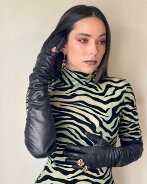 Mariel Molino Instagram - i was going for mrs. Peacock from Clue 🕵🏽‍♂️ 
@official_tca with @freeform for @thewatchfuleye coming in less than 17 days!! 

styled by @pabloriveraag 
makeup by @renapoli_beauty 
hair @mashyourhair 

@danielavillegasjewelry
@balmain
@versace
@gzv_creative