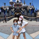 Marla Sokoloff Instagram - We’re back! 🐭 ✨Alec thoroughly enjoyed waiting in line for this photo. ✨ EDIT : masks are required friends or Mickey kicks you out. 🌟 . . #disneyland #disney #disneyfamily #cinderellacastle #familyphoto Disneyland