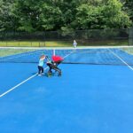 Mary Katharine Ham Instagram - A patient big sis practices tennis, but with obstacles. 🎾👧🏼👶🏻