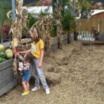 Mary Katharine Ham Instagram - It’s like some kind of curse that every time I go to the pumpkin patch 🎃, it absolutely must be 80 degrees. Four kids, fall clothes, August weather! A comedy of errors. I’m so glad I didn’t make them all wear matching cardigans or something. They are very dirty and we all had fun! (Also, the toddler is not being rude. The kids are encouraged to climb the pumpkin pile.)