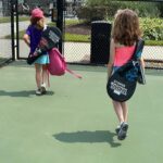 Mary Katharine Ham Instagram - A patient big sis practices tennis, but with obstacles. 🎾👧🏼👶🏻