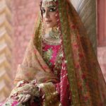 Maya Ali Instagram – 𝒁𝒂𝒓𝒍𝒊𝒔𝒉 𝑩𝒚 𝑴𝒐𝒉𝒔𝒊𝒏 𝑵𝒂𝒗𝒆𝒆𝒅 𝑹𝒂𝒏𝒋𝒉𝒂
Talpur Dynasty
Unstitched Festive Vol.4
Step into the lush and vibrant world of ‘Naranji Bagh,’ where the ensemble’s rani pink and red hues are a testament to its opulent charm. The embroidered organza shirt is a masterpiece, adorned with exquisite hand-embellished pearls, sequin and mirror work, and allover sequin detailing on the sleeves. Two different satin silk borders in parrot green and mustard add a unique and lively contrast.
The embroidered gharara, enriched with intricate details and embroidered satin silk border, adds a touch of sophistication to this ensemble. The printed dupatta on cotton slub, adorned with sequin and embroidered four-side satin silk border, completes the picture of timeless elegance. ‘Naranji Bagh’ is a celebration of color and craftsmanship, ideal for brides who seek an extraordinary and unforgettable look.
Muse: @official_mayaali
Videography: @muzammilgarewal
Jewellery: @allurebymht
Styling: @yash645
Hair & Mua: @sunil_mua
#mnr #mnrdesignstudio #mohsinnaveedranjha #mnrunstiched #talpurdynasty #mnrfestiveunstitched
#festiveunstitched23 #mnrlahore #mnrgujranwala #mnrkarachi #mnrusa #abubakarnaveedranjha #zarlishbymohsinnaveedranjha
