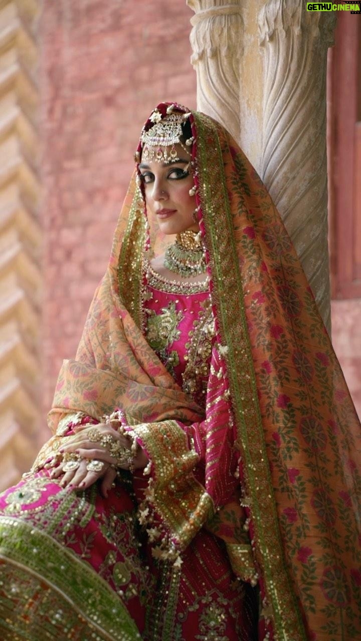 Maya Ali Instagram - πππππππ π©π π΄πππππ π΅πππππ
πΉπππππ οΌ΄ο½ο½ο½ο½ο½ οΌ€ο½ο½ο½ο½ο½ο½ Unstitched Festive Vol.4 Step into the lush and vibrant world of βNaranji Bagh,β where the ensembleβs rani pink and red hues are a testament to its opulent charm. The embroidered organza shirt is a masterpiece, adorned with exquisite hand-embellished pearls, sequin and mirror work, and allover sequin detailing on the sleeves. Two different satin silk borders in parrot green and mustard add a unique and lively contrast. The embroidered gharara, enriched with intricate details and embroidered satin silk border, adds a touch of sophistication to this ensemble. The printed dupatta on cotton slub, adorned with sequin and embroidered four-side satin silk border, completes the picture of timeless elegance. βNaranji Baghβ is a celebration of color and craftsmanship, ideal for brides who seek an extraordinary and unforgettable look. Muse: @official_mayaali Videography: @muzammilgarewal Jewellery: @allurebymht Styling: @yash645 Hair & Mua: @sunil_mua #mnr #mnrdesignstudio #mohsinnaveedranjha #mnrunstiched #talpurdynasty #mnrfestiveunstitched #festiveunstitched23 #mnrlahore #mnrgujranwala #mnrkarachi #mnrusa #abubakarnaveedranjha #zarlishbymohsinnaveedranjha