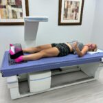 Meaghan B. Murphy Instagram - I'm #celiac, which means #gluten is the enemy, and I don't sufficiently absorb nutrients from food. This often leaves me Vitamin D deficient w/o supplements. I worry about my bone density as a result. I was excited for the DEXA (dual x-ray absorptiometry) scan at @princetonlongevity to determine my osteoporosis risk. 🩻 How it works: A very small dose of ionizing radiation produces pictures of your body—hips, spine, wrist. 🦴The non-invasive scan then analyzes these pictures to calculate how dense your bones are or if you're at risk for fractures. It's the gold standard diagnostic tool for osteoporosis. DEXA also measures body fat percentage, fat mass and fat free mass. (More on that in a second.) Turns out my bones are strong! I got my BMC (Bone Mineral Content) number aka the amount of bone tissue your skeleton currently has, as well as a T-score. The T-score is the standard by which doctors measure your bone mineral density. You want a score of +1 to -1 because it indicates normal bone mineral density. I'm at a 1.5. YAY! The thing that did shock me was my Body Mass Index. BMI calculated by taking your weight in KG and dividing it by the square of your height in meters is total bull! That formula doesn't account for body composition. You could have a body fat percentage of 10%, weigh 220lbs, have a height of 5'11, and be classified as obese. What?! DEXA is legit. It measures Fat Mass (amount of fat stored in your body in grams) and Lean Mass (skin, organs, muscles, water). Then it takes the sum of Lean Mass & Bone Mineral Content to come up with your Fat Free Mass. From here, DEXA determines what % of your body is composed of stored fat. Even though I am within 3lbs of my "ideal" weight, my total body fat was a surprising 26.7%. I was a little floored by that number. At my current weight of 128, I am made up of 34lbs of fat & 94lbs of lean mass. For optimal health, I'd like to swap 3lbs of fat for 3lbs of muscle. Knowing my aerobic capacity is at the 100th percentile for my age, this info is a nice nudge to do more weight training. Knowledge is power! Link in bio to learn more about PLC. #dexa #bonedensity #bonehealth #bodyfat #preventativehealth Princeton Longevity Center