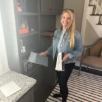 Meaghan B. Murphy Instagram - 🚨NEW 🏡 PROJECT🚨 Sometimes you need to fix 🛠️something that isn't broken just because it no longer works FOR YOU. That was the case with this sitting room. I loved the original design, but in 5 years NO ONE actually EVER sat in the sitting room. So, here's what we did to change that because with 3 kids and a dog we need to eek out every ounce of living space in our home: 🪑 First up, more functional furniture. We said goodbye to my oversized family heirloom chair (luckily Nana was excited to put it in her bedroom) and banished the stuffy (but pretty!) bench to my office. I saw these navy @potterybarn swivel chairs at my girlfriend's house and ordered them immediately. I have grown to appreciate the entertainment value of a swivel. Then I was at a loss, so I called in @thehavenly for a little design hand-holding. Havenly helped me land on this @arhaus table + ottomans & approved my striped @potterybarnkids rug choice (I needed the validation). WOWZA! Suddenly this space became a cozy spot for morning ☕️ after-dinner 🫖 and unwinding w/ a 🍷 where I can stare at my guitar 🎸 and the lyrics to Blackbird 🐦‍⬛ and manifest playing it someday. I think lessons would help. LOL The other big change here was brightening up the bookcases with a fresh coat of white. 🎨 I think it makes my book 📕 ⚡️& beloved knickknacks pop. Leave it to @shadyladycolors and @amazingpaintingnj to make the magic 🪄 happen. We also added battery-operated book lights from @lampsplus that make me endlessly happy at night. 💡 Finally, @ellaallure killed it with the Dempsey-friendly performance fabric cushion in just the right orange-y shade + fun patterned pillows. What do you think? I love that my friend @sarapeterson_thenext who founded HGTV mag calls small projects like this a "Twirl Up." I'm working on a whole issue of @womansdaymag devoted to mini makeovers like this. If you have a project to share, DM or email me! #makeover #homeproject #homerenovation #homerenovations #homeprojects #painting #bookshelves #arhaus Home Sweet Home