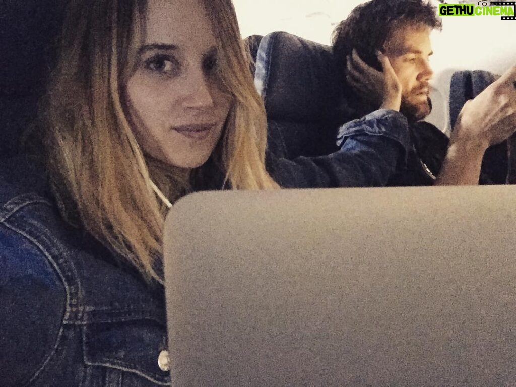 Megan Park Instagram - He has no idea I took this but the fact that we've been silently working next to each other on this airplane for 3 hours but he looks over and smiles at me every few mins is making my heart explode 😍🤓😍