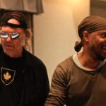 Michael Bearden Instagram - Big HBD🎉🎉 to the legend Neil Young! As a kid growing up on the south side of Chicago, the radio, and records were my close friends. Waaaaay before smart phones, social media and streaming. And for me, it didn’t matter what the genre was, or what color the artist was. I just loved music. ALL music! Still do. So imagine getting a call from a rock icon asking you to arrange and conduct an 80 + piece orchestra, and co-produce one of his records. 😳 It was yet another very surreal time in my whirlwind of a career I’ve had so far! If nothing else, I’m living proof you can come from anywhere and do anything if you believe you can! Enjoy 🎉Neil. And many more! (1/ me and Neil in studio. 2/ me and Neil at console. 3/ Neil’s classic record he signed for me! 4/ Neil thanking me for my work on his record. With the great Al Schmitt engineering. ☺️) s/o to the great Niko Bolas for making it all happen!