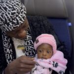 Michael Blackson Instagram - Ghana child support services met me on my flight and gave me this baby, I’m I the Fada or not?