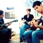 Michael Imperioli Instagram - Teaching actor JAMES DUVAL the chords to The Killing Moon as make-up artist LORENA LOPEZ looks on. This was on the set of the rarely seen indie film A RIVER MADE TO DROWN IN. -Hollywood, CA, Autumn of 1996. @realjamesduval #arivermadetodrownin
