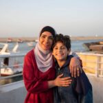 Mona Zaki Instagram - مع انتهاء موسم رمضان حابه أوجه الشكر لجمهوري في مصر والوطن العربي كله على كل التشجيع والحب اللي وصلني منكم.. شكرا لكل شخص أخد من وقته وكتب كلمة حلوة عن مسلسل #تحت_الوصاية. و أحب كمان أوجه الشكر لناس كتير جدا بداية من المخرج العظيم محمد شاكر خضير اللي عارف اللي في قلبي تجاهه وقد إيه هو فنان موهوب وعنده رؤية وحساس جدا.. وعلى المستوى الشخصي إنسانيته تفوق أي شيء أنا شوفته قبل كده، أنا بأدين له بكل الفضل على أي حاجة حلوة في المسلسل. بشكر المنتج الكبير محمد السعدي وشركة ميديا هب، وخالد وشيرين دياب على الفكرة والموضوع والإبداع اللي مش جديد عليهم وبيبهرونا في كل عمل جديد بمواضيع مهمة، ومدير التصوير المتميز بيشوي روزفلت اللي قدّم صورة عالمية.. وأحمد حافظ المونتير العالمي اللي اتشرفنا بوجوده معانا، و الإشراف الفني و الديكور للمهندس محمد عطية اللي موهبته طاغية في الوطن العربي كله، والشاطرة مصممة الأزياء ريم العدل و الموسيقي التصويرية للمبدعه ليال وطفه و بشكر مساعدين الإخراج على تعبهم ومثابرتهم.. و قسم الإنتاج و علي رأسهم المنتج الفني هاني عبد الله وكل رجالته.. ومهندس الصوت إسلام عبد السلام. .. والـ acting coach رامي الجندي، ومساعدتي الشخصية شيماء.. وطبعا فريق وكالة جينجر. وقبل أي حاجة بوجه الشكر طبعا لزمايلي في المسلسل اللي كلهم معجونين موهبة ولولاهم مكنش #تحت_الوصاية ظهر بالشكل ده.. حقيقي هما كتلة من المواهب المتحركة وعاشقين للفن من أكبر حد فيهم لحد البنوتة الصغيرة اللي فاجئتنا كلنا وأخيرا مش ممكن أنسى أهالى عزبة البرج وأجدع صيادين في مصر.. واللي حسسوني أني بقيت واحدة منهم طول فترة استضافتهم لينا. حقيقي فرحت بتعليقاتكم وتفاعلكم مع المسلسل، وأتمنى إنه يكون نقطة بداية لإعادة النظر في قوانين الوصاية وإعطاء الأمهات الحق في أولادهم.. الزمن بيتغير والأوضاع بتتغير والمرأة والأم والزوجة مش عنصر هامشي، دي الأساس اللي قايم عليه كل البيوت، وهي الأصل في حياة أولادها.. وكذلك الأب.. لذلك نتمنى من المشرّع إعادة النظر في مسألة الوصاية وفي بنود كتير في قانون الأحوال الشخصية عشان نحفظ حقوق الأولاد والآباء والأمهات. @mediahubadvertising @muhamadshaker @diabkhaled_ @bishoyrozaflt @attia_productiondesigner @ahmedhfz @reemeladl @layal.watfeh @hanyabdallah001 @ginger__tm @roshdy_elshamy @diabel3aw @khaledkamalofficial @eltayeb.official @ahmedkhaledsalleh @alisobhyofficial @mahanassarofficial @ahmedabdelhamidoff @omar.sherif.actor @noha.abdin.official @tharaa.goubail
