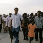Muhammad Ali Instagram - Muhammad Ali walking with youth fans along the River Zaire before his fight vs George Foreman at the presidential complex outside of Kinshasa. ⁣ ⁣ N'Sele, Zaire – October 1974.⁣ ⁣ 📸: @neilleiferphotography⁣ ⁣ ⁣ #MuhammadAli #Icon #RumbleintheJungle #MuhammadAlivsGeorgeForeman #Boxing #Legendary #GOAT #Champion