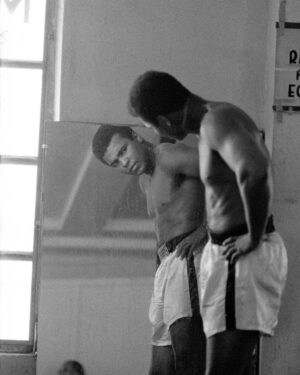Muhammad Ali Instagram - Muhammad Ali looking in the mirror while training at the 5th street gym in Miami Beach, Florida.⁣
⁣
October 1970.⁣
⁣
📸: @neilleiferphotography⁣
⁣
⁣
#MuhammadAli #Icon #NeilLeifer #Photography #Mirror #Boxing #Champion #Gym #MiamiBeach #Florida