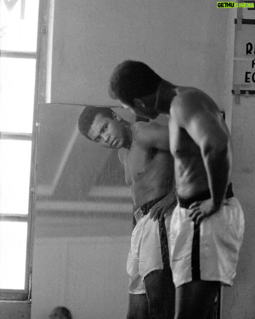Muhammad Ali Instagram - Muhammad Ali looking in the mirror while training at the 5th street gym in Miami Beach, Florida.⁣ ⁣ October 1970.⁣ ⁣ 📸: @neilleiferphotography⁣ ⁣ ⁣ #MuhammadAli #Icon #NeilLeifer #Photography #Mirror #Boxing #Champion #Gym #MiamiBeach #Florida