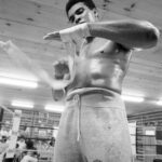 Muhammad Ali Instagram - Muhammad Ali wrapping his hands during a photo shoot at in Deer Lake, PA.⁣ ⁣ 📸: @neilleiferphotography⁣ ⁣ ⁣ #MuhammadAli #TrainingCamp #Icon #DeerLake #HandWraps #NeilLeifer #Champion