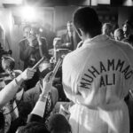 Muhammad Ali Instagram - Muhammad Ali during a media interview before his fight vs Ernie Terrell at the Astrodome. ⁣ ⁣ Houston, Texas.⁣ February 1967. ⁣ ⁣ 📸: @neilleiferphotography⁣ ⁣ ⁣ #MuhammadAli #Icon #Star #Boxing #Champion #ErnieTerrell #HoustonAstrodome #NeilLeifer #Photography