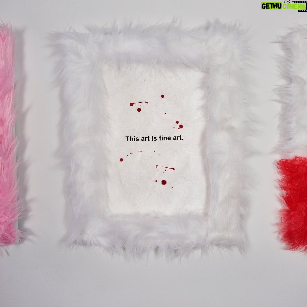 Nadezhda Tolokonnikova Instagram - This art is a hammer that shapes reality (series) π©Έπ¨ 2023 The text is printed on fabric. I use textile because traditionally it was labeled as low art/crafts, female work - and because I was forced to work with textile in my penal colony. The fabric is stapled to canvas, and pink and white fur is stapled to canvas as well. I use pins, needles, and parts of the sewing machine in this series, finally fulfilling my prison dreams about getting new sets of needles - now I'm a free person and can just order them online, it was a big pleasure ordering them! "We can't give you new needles and parts to fix your machine, did you forget where you are? You're in RUSSIA" - I was told in prison when I asked to fix my equipment. Splashes of acrylic paint on the fabric are reminiscent of my blood getting spilled on police and military uniforms that I was sewing in prison, injured by old and outdated equipment. For more solid red paint coverage - like in "This art screams in pain" piece - I used red spray paint, a tool that was widely used in my activist anarchist youth. Teddy bears are penetrated with needles like my fingers used to be when I was sewing in prison, teddy bears are covered in Putin's Ashes - I saved a bucket of ashes after the performance in August 2022 and now use it as art material. I combine cute and dangerous, playful and serious in this series, just like we did in our name, Pussy Riot. The harsh statements are combined with plush toys and faux fur π£π Once Marina Abramovic asked me why I like baby pink so much, she hates baby pink. I said that I want to look cute when cops are arresting me, I want them to look stupid. She said, ok, you're the only person I can accept wearing baby pink and hello kitty backpacks.