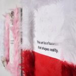 Nadezhda Tolokonnikova Instagram - This art is a hammer that shapes reality (series) 🩸🔨 2023 The text is printed on fabric. I use textile because traditionally it was labeled as low art/crafts, female work - and because I was forced to work with textile in my penal colony. The fabric is stapled to canvas, and pink and white fur is stapled to canvas as well. I use pins, needles, and parts of the sewing machine in this series, finally fulfilling my prison dreams about getting new sets of needles - now I'm a free person and can just order them online, it was a big pleasure ordering them! "We can't give you new needles and parts to fix your machine, did you forget where you are? You're in RUSSIA" - I was told in prison when I asked to fix my equipment. Splashes of acrylic paint on the fabric are reminiscent of my blood getting spilled on police and military uniforms that I was sewing in prison, injured by old and outdated equipment. For more solid red paint coverage - like in "This art screams in pain" piece - I used red spray paint, a tool that was widely used in my activist anarchist youth. Teddy bears are penetrated with needles like my fingers used to be when I was sewing in prison, teddy bears are covered in Putin's Ashes - I saved a bucket of ashes after the performance in August 2022 and now use it as art material. I combine cute and dangerous, playful and serious in this series, just like we did in our name, Pussy Riot. The harsh statements are combined with plush toys and faux fur 💣🐁 Once Marina Abramovic asked me why I like baby pink so much, she hates baby pink. I said that I want to look cute when cops are arresting me, I want them to look stupid. She said, ok, you're the only person I can accept wearing baby pink and hello kitty backpacks.