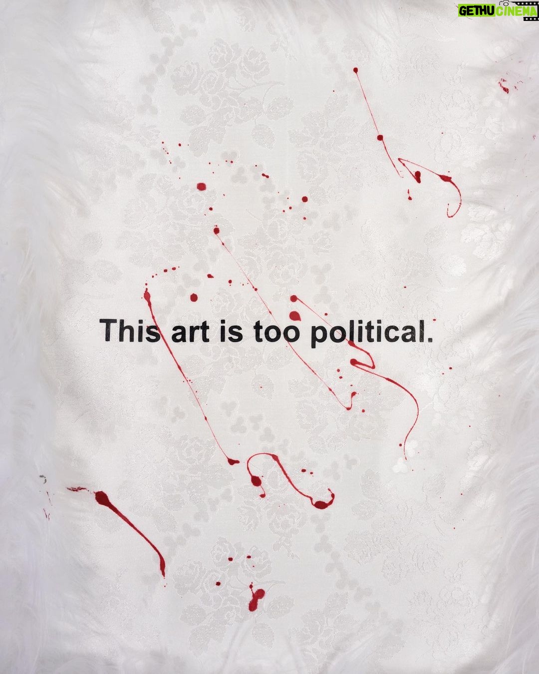 Nadezhda Tolokonnikova Instagram - This art is a hammer that shapes reality (series) π©Έπ¨ 2023 The text is printed on fabric. I use textile because traditionally it was labeled as low art/crafts, female work - and because I was forced to work with textile in my penal colony. The fabric is stapled to canvas, and pink and white fur is stapled to canvas as well. I use pins, needles, and parts of the sewing machine in this series, finally fulfilling my prison dreams about getting new sets of needles - now I'm a free person and can just order them online, it was a big pleasure ordering them! "We can't give you new needles and parts to fix your machine, did you forget where you are? You're in RUSSIA" - I was told in prison when I asked to fix my equipment. Splashes of acrylic paint on the fabric are reminiscent of my blood getting spilled on police and military uniforms that I was sewing in prison, injured by old and outdated equipment. For more solid red paint coverage - like in "This art screams in pain" piece - I used red spray paint, a tool that was widely used in my activist anarchist youth. Teddy bears are penetrated with needles like my fingers used to be when I was sewing in prison, teddy bears are covered in Putin's Ashes - I saved a bucket of ashes after the performance in August 2022 and now use it as art material. I combine cute and dangerous, playful and serious in this series, just like we did in our name, Pussy Riot. The harsh statements are combined with plush toys and faux fur π£π Once Marina Abramovic asked me why I like baby pink so much, she hates baby pink. I said that I want to look cute when cops are arresting me, I want them to look stupid. She said, ok, you're the only person I can accept wearing baby pink and hello kitty backpacks.