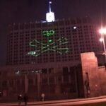 Nadezhda Tolokonnikova Instagram - WAGNER, WE DID IT FIRST. STORM OF THE WHITE HOUSE / ШТУРМ БЕЛОГО ДОМА: art action by Voina group, Moscow, 2008 Voina, art collective that I co-founded, brought a large laser projector into the attic room of a hotel "Ukraine" located across the street from the Russian White house. From there we projected a 40 x 40 meters image of a skull and bones on the white house. Other group members on the ground then stormed the building gates and successfully entered the secure zone in front of the building. After holding ground and destroying a piece of video surveillance activists left the White House unharmed, with stunned federal troopers unable to catch up with the speed of the Voina attack, appearing minutes later.