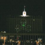 Nadezhda Tolokonnikova Instagram - WAGNER, WE DID IT FIRST. STORM OF THE WHITE HOUSE / ШТУРМ БЕЛОГО ДОМА: art action by Voina group, Moscow, 2008 Voina, art collective that I co-founded, brought a large laser projector into the attic room of a hotel "Ukraine" located across the street from the Russian White house. From there we projected a 40 x 40 meters image of a skull and bones on the white house. Other group members on the ground then stormed the building gates and successfully entered the secure zone in front of the building. After holding ground and destroying a piece of video surveillance activists left the White House unharmed, with stunned federal troopers unable to catch up with the speed of the Voina attack, appearing minutes later.