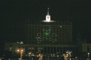 Nadezhda Tolokonnikova Instagram - WAGNER, WE DID IT FIRST. 

STORM OF THE WHITE HOUSE / ШТУРМ БЕЛОГО ДОМА: art action by Voina group, Moscow, 2008

Voina, art collective that I co-founded, brought a large laser projector into the attic room of a hotel "Ukraine" located across the street from the Russian White house. From there we projected a 40 x 40 meters image of a skull and bones on the white house. 

Other group members on the ground then stormed the building gates and successfully entered the secure zone in front of the building.

After holding ground and destroying a piece of video surveillance activists left the White House unharmed, with stunned federal troopers unable to catch up with the speed of the Voina attack, appearing minutes later.