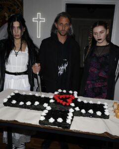 Nadezhda Tolokonnikova Instagram - 💒🔪🫀💍 и умерли в один день x @vegsurfer @nytimes 📝: Nathan Monk, a priest who left the Russian Orthodox Church because he did not support its stance on gay marriage, led a ceremony. Ms. Tolokonnikova’s daughter @gerariot made the party’s playlist, which featured Soviet pop and contemporary Russian trap. For food, Ms. Tolokonnikova suggested serving pickles and vodka, but Mr. Caldwell insisted on something more robust. Ms. Tolokonnikova baked a large vegan Napoleon cake, dyed it black and assembled it in the shape of a cross, a symbol she uses often in her artwork. The dress code was “gopnik,” a word that encapsulates a style of dress, music and art reflecting the working class in the former Soviet states in the 1980s and 1990s. Guests showed up in tracksuits, house slippers, Adidas slides and newsboy caps, and one brought an accordion. Photos: @thecobrasnake Article: @vsaffron Priest: @fathernathan