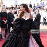 Nadine Njeim Instagram - I have always been fascinated by the glamour of the 50s era. The era of Brigitte Bardot and Sofia Loren.… You know, I love how back then, women embraced their curves, fashion was bold, yet feminine… And here we are today… Zuhair and I decided to create a custom made dress inspired by this golden Era and this magical city… Cannes… Thank you for every person who made this vision come to life… Thank you @chopard for hosting me 🤍🖤