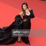 Nadine Njeim Instagram - I have always been fascinated by the glamour of the 50s era. The era of Brigitte Bardot and Sofia Loren.… You know, I love how back then, women embraced their curves, fashion was bold, yet feminine… And here we are today… Zuhair and I decided to create a custom made dress inspired by this golden Era and this magical city… Cannes… Thank you for every person who made this vision come to life… Thank you @chopard for hosting me 🤍🖤