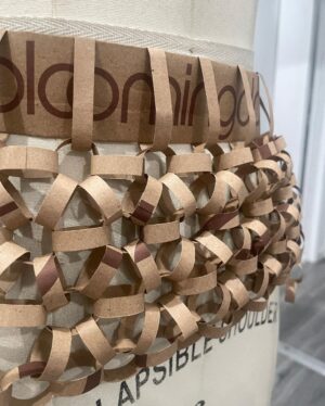 Natalia Fedner Instagram - Surprise!!! When @bloomingdales reached out to me about making a dress to celebrate the 50th anniversary of the Big Brown Bag - I was immediately on board! I wanted to bring my brand’s DNA to the project, while maintaining the integrity of the iconic Big Brown Bag kraft paper aesthetic. So I created a special chainmail made from actual Bloomingdale’s Big Brown Bags. This tiny paper chainmail, like my metal designs, is entirely hand made. The process starts by cutting the BBBs into 8.5 x 11” sheets, ironing them flat (yes, flashbacks to pressing paper patterns out at Parsons were had), then cutting the sheets into thousands of small strips using a hand held paper cutter (that I may have found tossed out on a street corner by my West Hollywood apartment…), and finally taping them together with little double sided tabs to create a honeycomb like pattern. I used this technique to create the skirt for the project, finishing it off with a Bloomingdales waistband (sourced from the side of the bag). The paper skirt is delicate, but because of the technique I developed for the project, it actually stretches quite a bit and allows a full range of movement! For the top, I wanted to design something a little more clean and simple that really focused on the theme. So I opted for a 90’s style bandeau top with the famous words front and center, integrating hand straps from actual bags to create shoulder straps for the top. By incorporating a few smart darts in the front and some corset work in the back, I was able to transition a Big Brown Bag into a Small Sleek Top. The overall silhouette of the look gives a wink to the 1950s, celebrating Bloomingdales lasting impact on fashion. Swipe through for a small taste of BTS - more to come! And yes model @lamekafox IS wearing a pair of our own chain earrings! 

Shoutout to @riowarner and @maya_adelle - this was a true labor of love that involved thousands of little movements - little cuts, little bits of tape - and these two rockstars made sure I got the project done in time by helping prep thousands of paper tabs for me. And thank you @p810km for being our fit model 🥰 Thank you @ela.ine.k @tatootsie for bringing me on!!