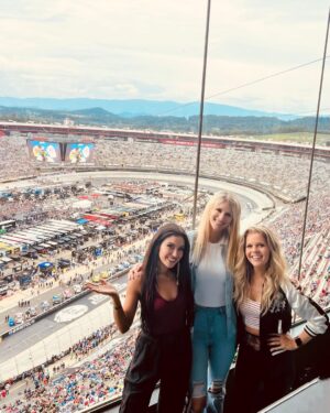 Natalie Stovall Instagram - 🏁 Bristol Baby!! 🏁 
When I was little, my big brother, Joe, would have his friends over every weekend for the @nascar races. And inevitably, when a break would happen, there was always a “Natalie! Go get your fiddle!” So I’d play a few songs and feel like the coolest kid around. 
Fast forward to this past weekend, I attended my very first race, in the “coolest kid” way possible… (thank you @quartzhillrecords 🤍🥂) and I found myself again playing that fiddle, as us ladies did a little acoustic set for some VIP’s. It was so much fun cheering for @tyler_reddick and getting to soak it all in! What an experience!!! Swipe to the end to see Joe-Bob and little me.