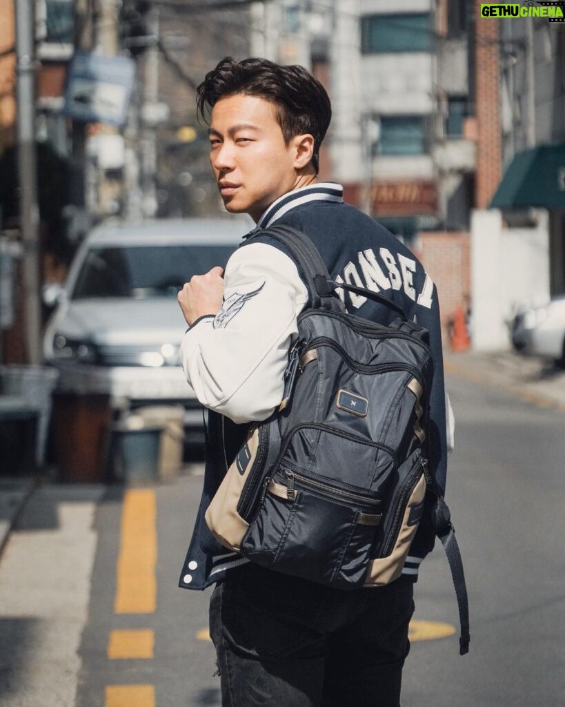 Nathaniel Ho Instagram - Whether I'm headed to school, my studio, or even exploring Seoul (and beyond), my Alpha Bravo Navigation Backpack from @tumitravel is the perfect companion. I love that this new range is rugged but light, and has a ton of compartments - definitely very utilitarian and practical. It's made with sustainable materials too! The backpack itself is stylishly compact, yet has an expandable zipper to accommodate extra items if needed. The bag straps are also broad and well-cushioned, making my commutes comfortable and enjoyable. I’m definitely looking forward to more adventures with my #TUMI ✈️ #TUMISG #UnpackTomorrow @wcommunications.sg Seoul, Korea