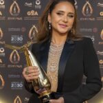Nelly Karim Instagram – What a legendary and joyful night! Thank you @joyawards.official. I am deeply honored to have won the Best Actress in Film Award for my role in Voy! Voy! Voy!, a project very close to my heart written and directed by the brilliant Omar Hilal in his cinematic debut, and I’m extremely proud that it has been chosen to represent Egypt at the Oscars this year. 

It is a great honor to be awarded alongside Egyptian, Arab, Hollywood, sports, music and fashion greats such as Adel Imam and Anthony Hopkins.

Congratulations to all awardees and to the team behind Joy Awards and Saudi Arabia’s General Entertainment Authority  for this extraordinary night and for bringing Arabia closer to international audiences. 

I already look forward to next year’s edition.

 شكرا “جوائز صنّاع الترفيه” Joy Awards علي هذه الأمسية الرائعة. تشرفت بحصولي علي جائزة افضل ممثلة سينما عن دوري في فيلم ڤوي!ڤوي!ڤوي! اول أعمال الكاتب و المخرج عمر هلال الذي اعتز به جدا و أفتخر بتمثيله لمصر في جائزة أوسكار أفضل فيلم عالمي هذا العام. 

يزيدني شرفا تكريمي بجوار الزعيم عادل إمام و النجم العالمي أنطوني هوبكينز و النجمة نجاة الصغيرة و نجوم الفن و السينما و الموسيقي و الرياضة . مبروك لكل الزملاء و الأصدقاء علي جوائزهم و مبروك للهيئة العامة للترفيه علي النجاح الكبير لهذا الحدث الاستثنائي الذي يقرب منطقتنا الي العالمية. الي إلقاء في الدورة القادمة.