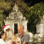 Nia Dinata Instagram - Christmast at the Temple..with Javanese Santa❤️💚 and Quarantini is a bit affraid of mbah Santa🙏🏼🌲sending love from Jogja to all over😇🙏🏼 #christmas2023 #loveandlight #mbahsanta #niamaste Candi Tirto Raharjo