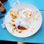 Nicholle Tom Instagram - Find you’re #HappyPlace and watch tonight’s #RockinRedShoes kick some arghssss …🥴😵‍💫 #Worstcooks #ImRightWhereIBelong @foodnetwork @discoveryplus #BestShrimpTacos @tipsytunabelize #CouldntResist the monkey & the bear! #Yummers Tipsy Tuna Placencia