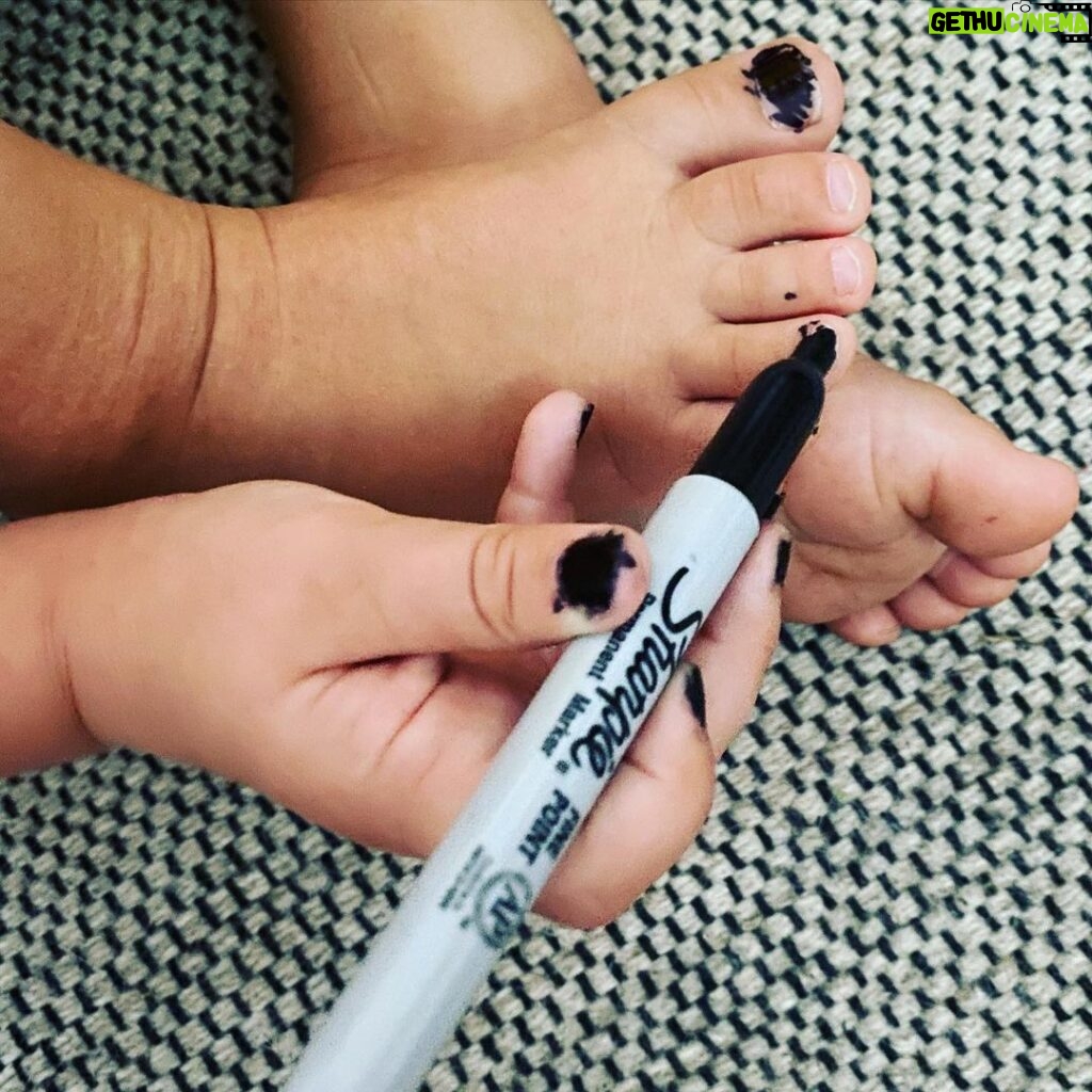 Nicole da Silva Instagram - She’s quiet, though. @sharpie #PenLicence #IfYouKnowYouKnow #Dexterity Image Description: A small child’s hand with black nails, colours in her toenails with a black Sharpie.