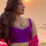 Nikita Sharma Instagram - Navratri series 💜✨ Here is look 3 from @anjanabohra_official @anjanase_official ☺️ A burst of purple against an orange vibrant sunset sky! 🌅 #feelitreelit #festive #festivity #navratri #lehenga #indian