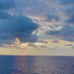 Norah Casey Instagram - I try never to miss a sunrise and this one at 6.40 over the ocean was beautiful … I was the only eejit on the top deck waiting for that little orange spark… it’s cloudy and I’ve seen more spectacular sunrises… but the one right in front of you is always the perfect sunrise, for that moment and that brand new day. Thankful as ever that I have a whole day of adventure ahead on the @norwegian__viva #inaugralsailing … full review @womansway and my new magazine #planetwomantravel