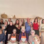 Norah Casey Instagram - As the temperature hit 25 degrees we headed up to the village of Sarnadas in the parish of Alte and a little weaving workshop, Casa do Esparto, based in the repurposed Escola Primária das Sarnadas. It’s one of a network of artisan spaces of the Loulé Criativo project which is revitalising ancient creative traditions in the region. There I met this wonderful woman Donna Aldegundes Gomes, born in the village, she proudly tells me she’s 89 years old and 60 years a weaver. She has a big heart, skilful hands and a wide smile. You can tell she loves what she does. Now she is passing on her knowledge to new generations and enthusiastic amateurs like me. She and the other women in the collective use Esparto grass which grows wild in this area - the Barrocal lands of the Algarve interior. Essential back in the day for carpets, rugs, baskets and much more, the women are bringing back the traditional method and weaving patterns to create lovely unique pieces, some decorative, many practical. I was in the baby class making key rings which was a lovely hands-on, gentle and calming experience. Hands touching hands, heads bent close together nudging the grasses into new shapes and patterns. #creativityinaction @loule_criativo @visitalgarve