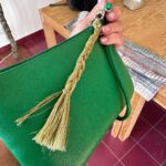 Norah Casey Instagram - As the temperature hit 25 degrees we headed up to the village of Sarnadas in the parish of Alte and a little weaving workshop, Casa do Esparto, based in the repurposed Escola Primária das Sarnadas. It’s one of a network of artisan spaces of the Loulé Criativo project which is revitalising ancient creative traditions in the region. There I met this wonderful woman Donna Aldegundes Gomes, born in the village, she proudly tells me she’s 89 years old and 60 years a weaver. She has a big heart, skilful hands and a wide smile. You can tell she loves what she does. Now she is passing on her knowledge to new generations and enthusiastic amateurs like me. She and the other women in the collective use Esparto grass which grows wild in this area - the Barrocal lands of the Algarve interior. Essential back in the day for carpets, rugs, baskets and much more, the women are bringing back the traditional method and weaving patterns to create lovely unique pieces, some decorative, many practical. I was in the baby class making key rings which was a lovely hands-on, gentle and calming experience. Hands touching hands, heads bent close together nudging the grasses into new shapes and patterns. #creativityinaction @loule_criativo @visitalgarve
