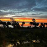 Norah Casey Instagram - My last sunrise at #portcanaveral and it’s a spectacular one from this side of the Atlantic Ocean… yesterday I listened to a seasoned #nasaastronaut who’s been way up there on multiple space trips - he reminded me that the International Space Station orbits Earth about every 90 minutes—enough for astronauts to witness 16 sunrises and 16 sunsets each day… wow - that must be something. I’m happier down here on earth witnessing my daily ritual of our own sun rising but a day with my head in the vast universe of our galaxy and the gazillions beyond at the #kennedyspacecenter made me think a lot about life and our tiny little corner in the #milkywaygalaxy … but I didn’t feel small, I felt privileged to wake up each morning and witness our sun rise on a brand new day… full of all the possibilities that life brings. And this morning it was like an extra special gift with big brushstrokes of crimson, pinks yellows and blues 💚 Kennedy Space Center