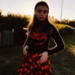 Olive Elise Abercrombie Instagram – Stretchy face pumpkin sweater bringing extra horror to the haunted corn maze this year. 🎃 🔪 Uncle Shucks Corn Maze and Pumpkin Patch