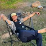 Orlando Bloom Instagram - Ahead of earth day 🌎 chopping wood & carrying water it doesn’t get much better 🏕️🫶🐞
