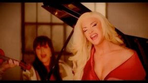 Our Lady J Instagram - Thrilled to record this gorg song with our queen @xosonique! The music video is out now, YouTube it. #completeme 🏳️‍⚧️ 

video sponsored by : @cranects / directed by @hammerbrad / Song written by @iamjohnduff and @samjgarfield / producer : @runwithcommando /photos & producer: @bob_of_scotland_studio / creative director & editor : @Aurorasexton / DP : @justinmarkmorrison / 2nd cam @graymorison / prod manager : @nicholasmonaco / makeup : @callitodeh / stylist : @dakotapayneofficial /wardrobe : @augustgettyatelier / starring : @theofficialamazonashley @calpernia @ourladyj @ezramichelmusic @eurekaohara @traciejada @carter_rayy @tristanriggsofficial @laganjaestranja @novadonnell @iamdayday /bts photos, art work for cover and interviews @birdlambro