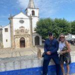 Patricia Heaton Instagram - On the way back to Lisbon from Nazaré we stopped in Óbidos, one of the most beautifully preserved villages I’ve ever visited. Beautiful cobbled streets lined with historic buildings drenched in flowers. Obidos Portugal