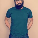 Paul Walling Instagram - Hi! I put on a clean shirt (but not clean jeans), left my apartment (but not my neighborhood), and even doffed my mask for a bit (but not my beard.) 📷: @gregendries 👕: @shop.perk 💪: 🍝🍜