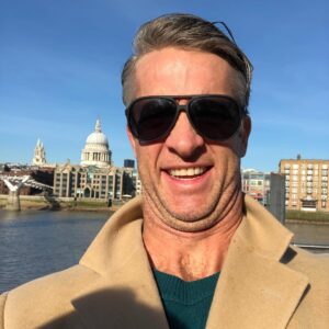Penn Holderness Instagram - I’m in London! Does this camel coat make me look like the secre aCHINt James Bond? #ShaCHINnotStirred
