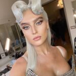 Perrie Edwards Instagram – Her name was Perrie, she was a showgirl, her dress and wings weighed a ton but she bossed it like a hun 🎶