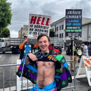 Pinar Toprak Instagram - I’m so lucky and proud to be his mom ❤️ 🏳️‍⚧️ I love you so much @noah.toprak ⁣
⁣
• Repost from @noah.toprak⁣
This isn’t a typical post, I apologize about that. I wanted to post this to show how ignorant people can be. At the pride parade, protesters were telling us to k*ll ourselves, amongst other terrible things. This picture is of me showing my top surgery scars in front of these “protestors”. What these people fail to understand is the impact that gender affirming care can have. I was/am incredibly fortunate to have such a supportive family. My mom, @pinartoprakcomposer, helped me achieve my dreams. Without her and her support, I wouldn’t be here. So to all the parents and people in general, listen to others. Especially parents. Listen to your kids. Help them grow to be happy in their body. Give them a chance to be free. Being trans isn’t a choice. It’s who we are. Your love and support could save lives.  #trans #transgender #transman #pridemonth #pride #prideparade #loveislove #transrightsarehumanrights #topsurgery #support⁣