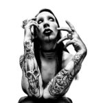 Platon Instagram - marilyn manson. “I took this picture in 1997 while Marilyn Manson was on tour in Hawaii. We transformed the infamous hotel suite where Elvis used to stay into my photo studio. Manson was polite, mild-mannered and introverted - yet also a dynamic visual collaborator. We talked about hypocrisy and failed leadership while a tropical storm raged in paradise that day. I took him outside onto the balcony overlooking the windswept palm trees. Although I focused on the tormented background scene, you can still see all the scars on his chest from his violent stage act. Now, Marilyn Manson is 50 years old, and so am I. Here’s to being a true cultural provocateur. Marilyn Manson, I salute you.”